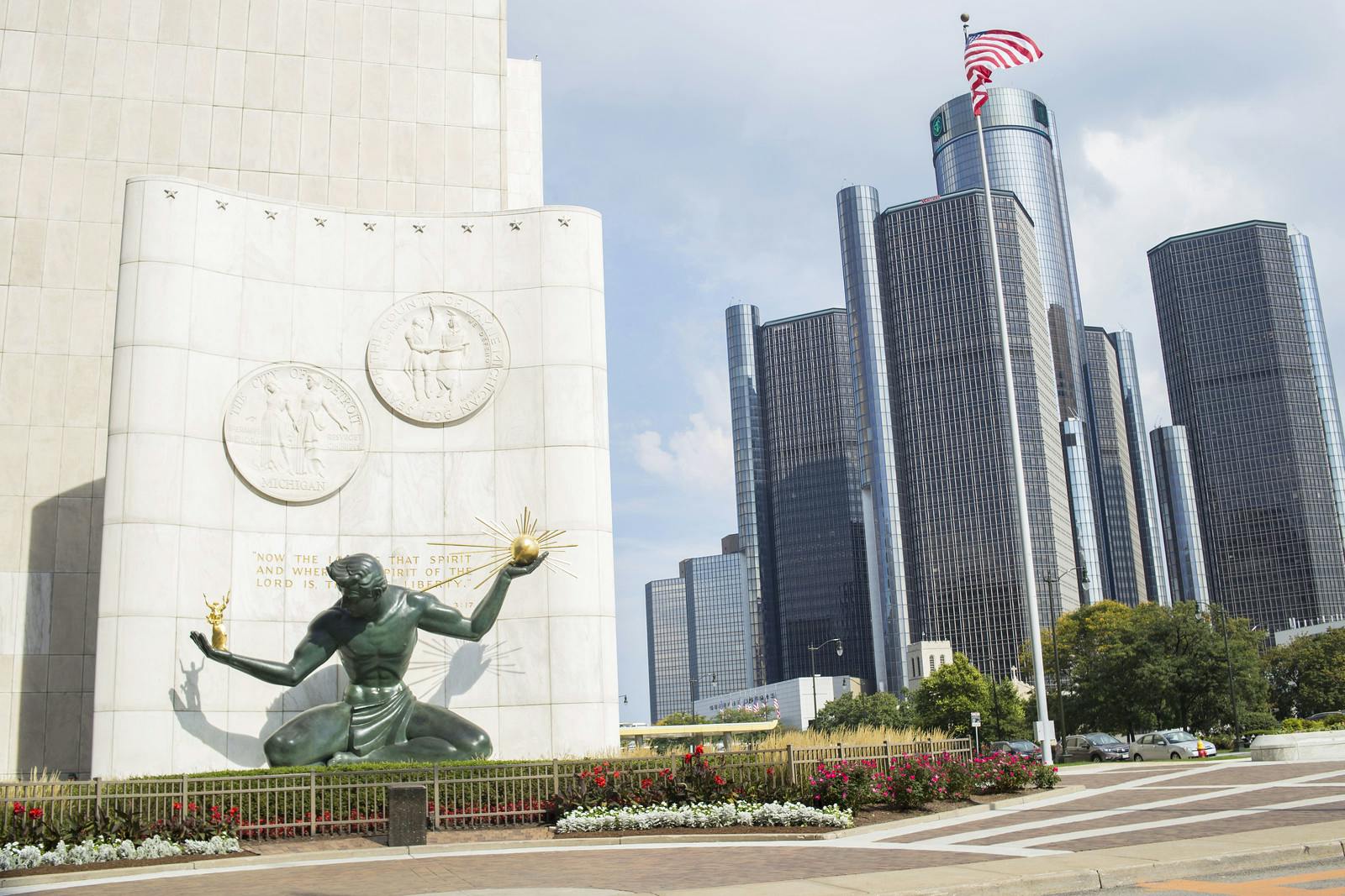 Spirit of Detroit statue with Renaissance Center in the background